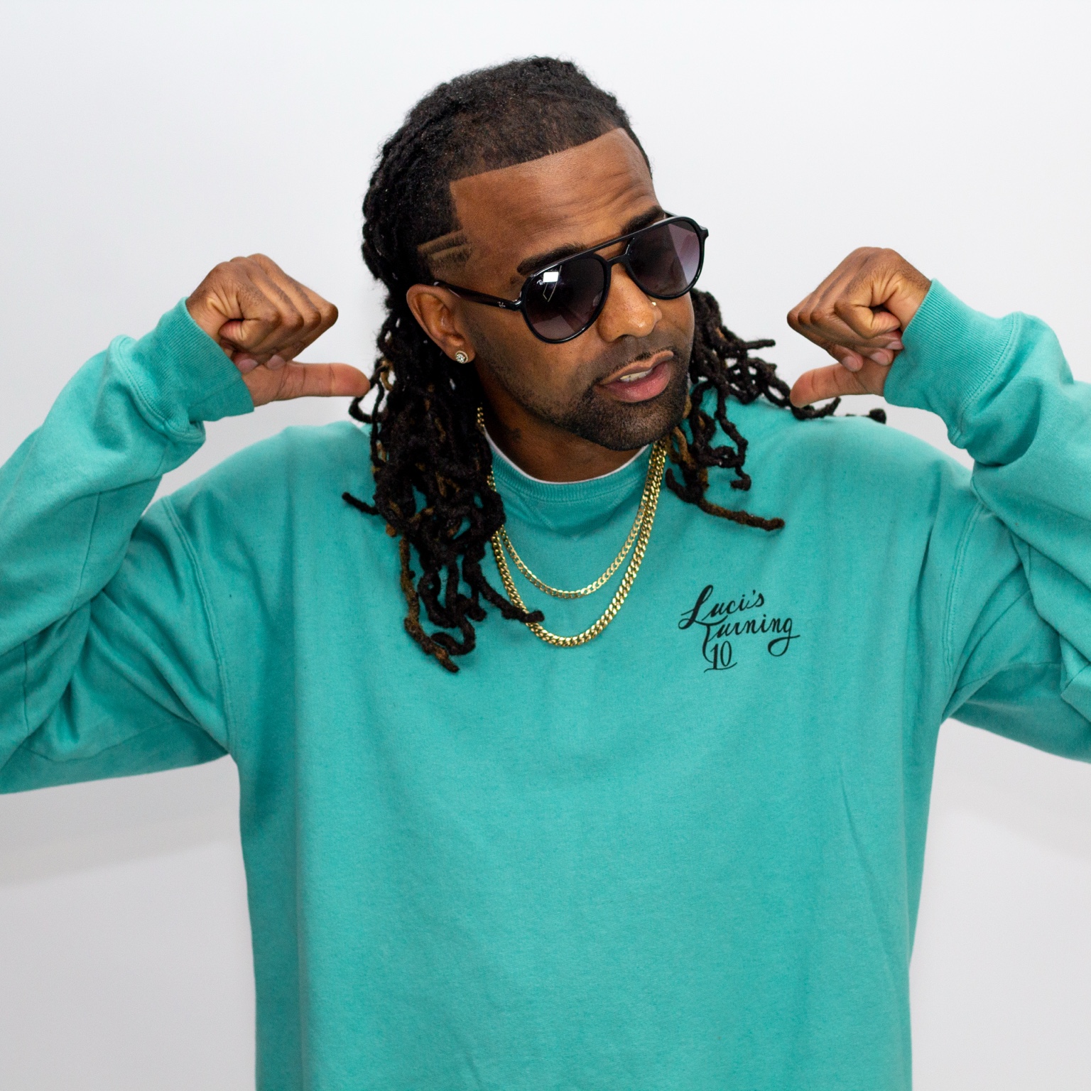 Artist wearing teal during a studio portrait session